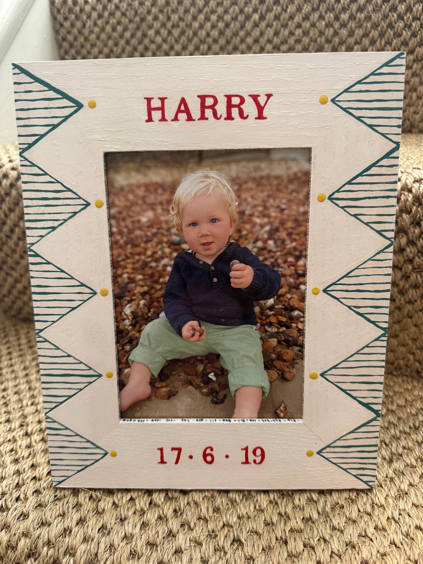 Close-up of hand-painted green geometric design on white oak children's photo frame — personalised gift by Mimi & Mots