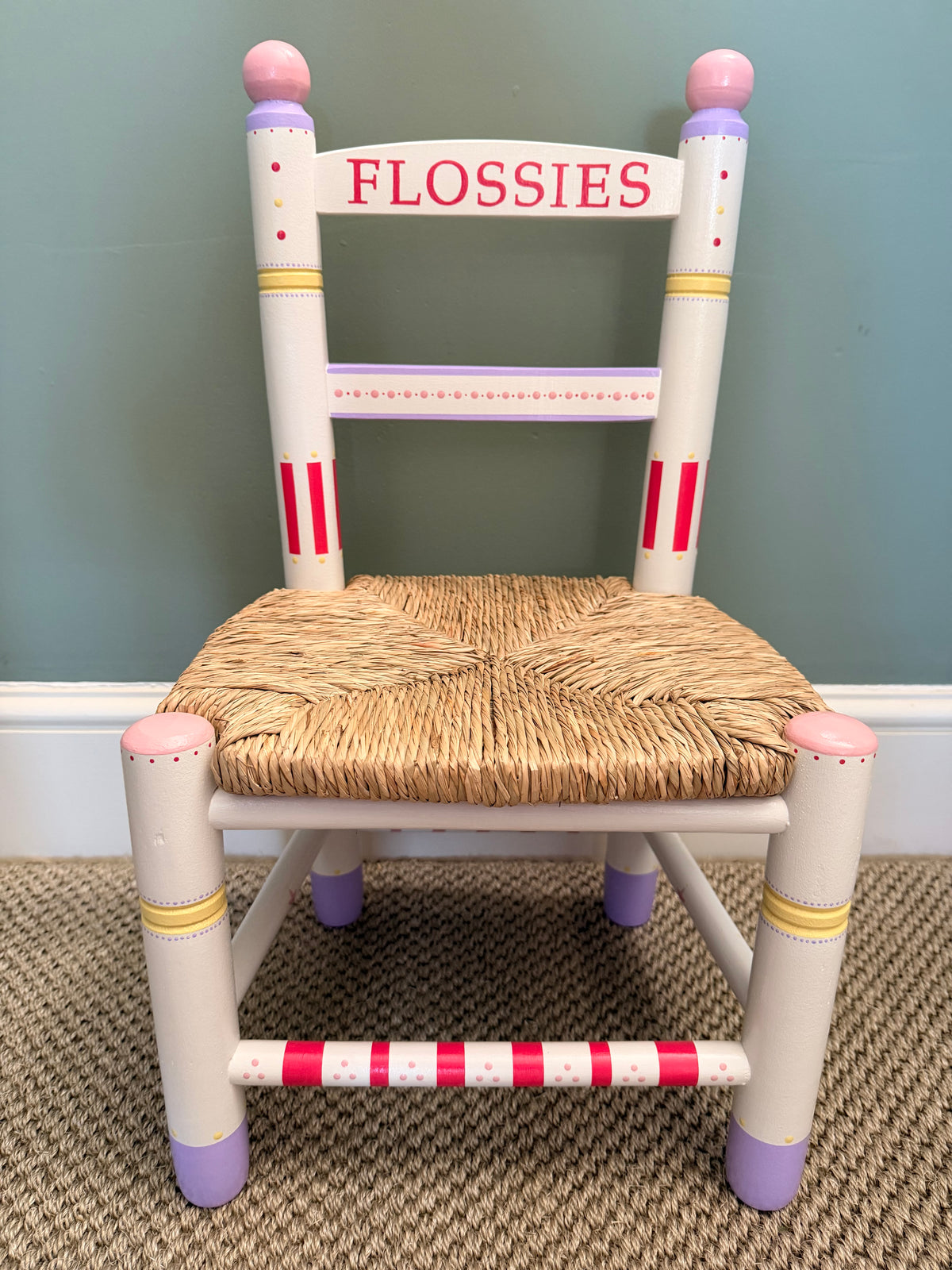 Nursery decor with a Childs wooden handpainted chair. 