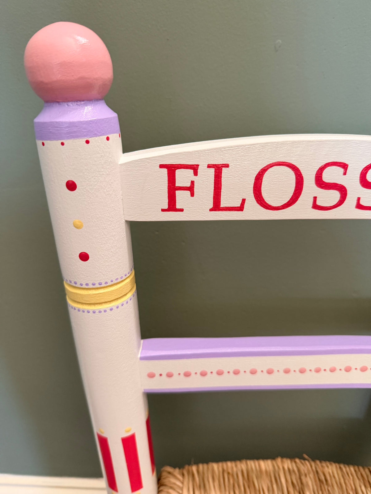 Close up for a christening chair for a child. Bright colours for nursery decor. 