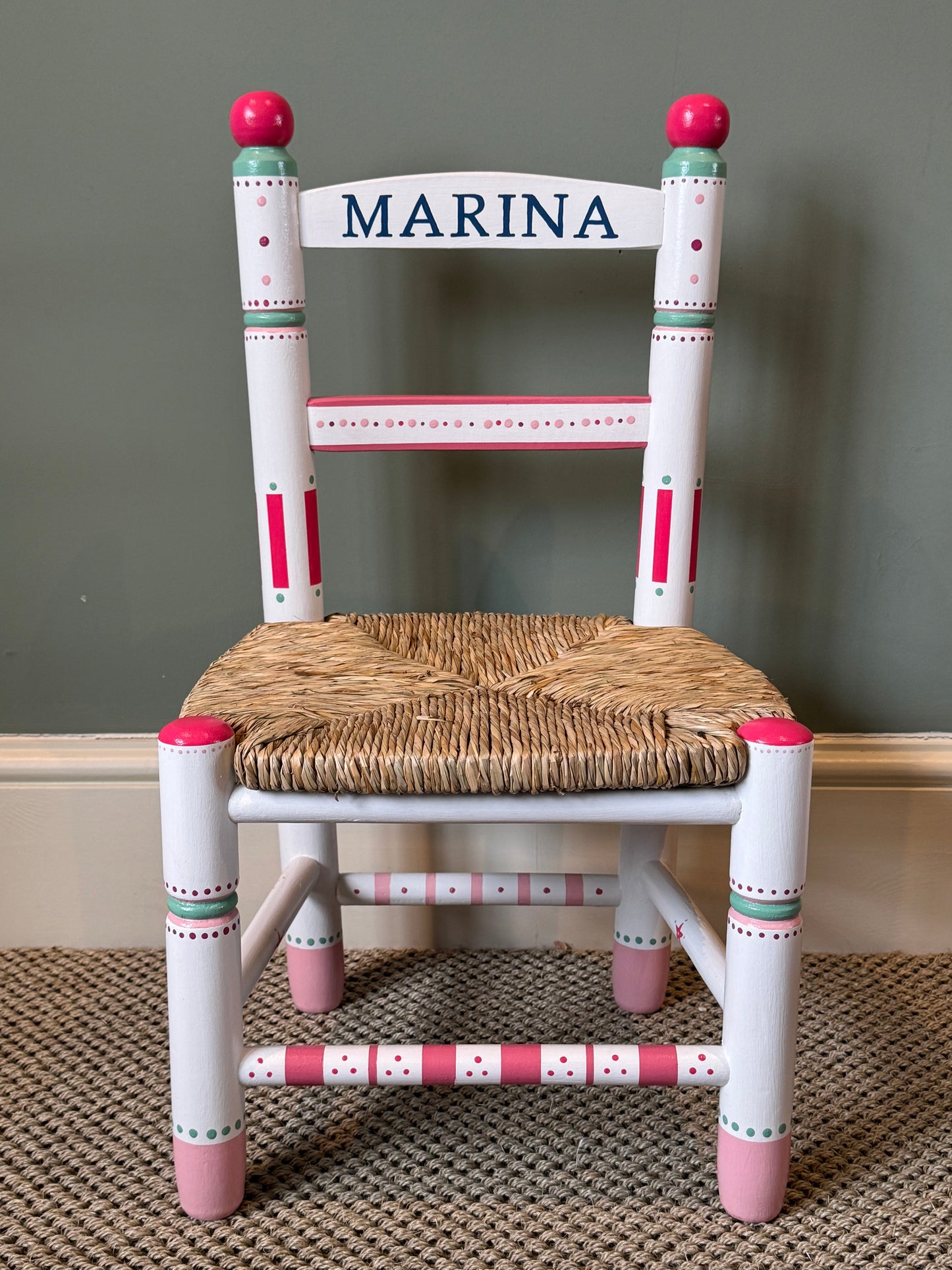 Personalised hand-painted children's chair with woven rush seat.  A unique gift for a child. 