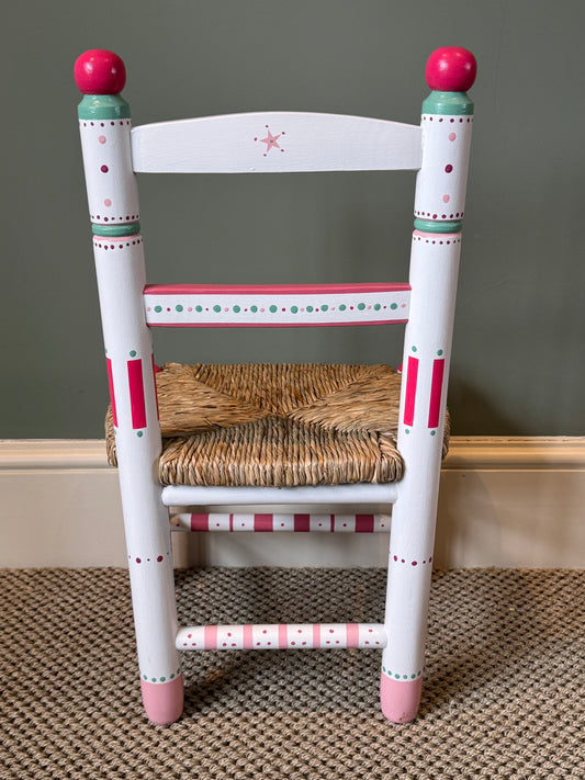 Rear view of personalised Marina children's chair in pink and green with traditional woven rush seat, handmade in the UK — Mimi & Mots
