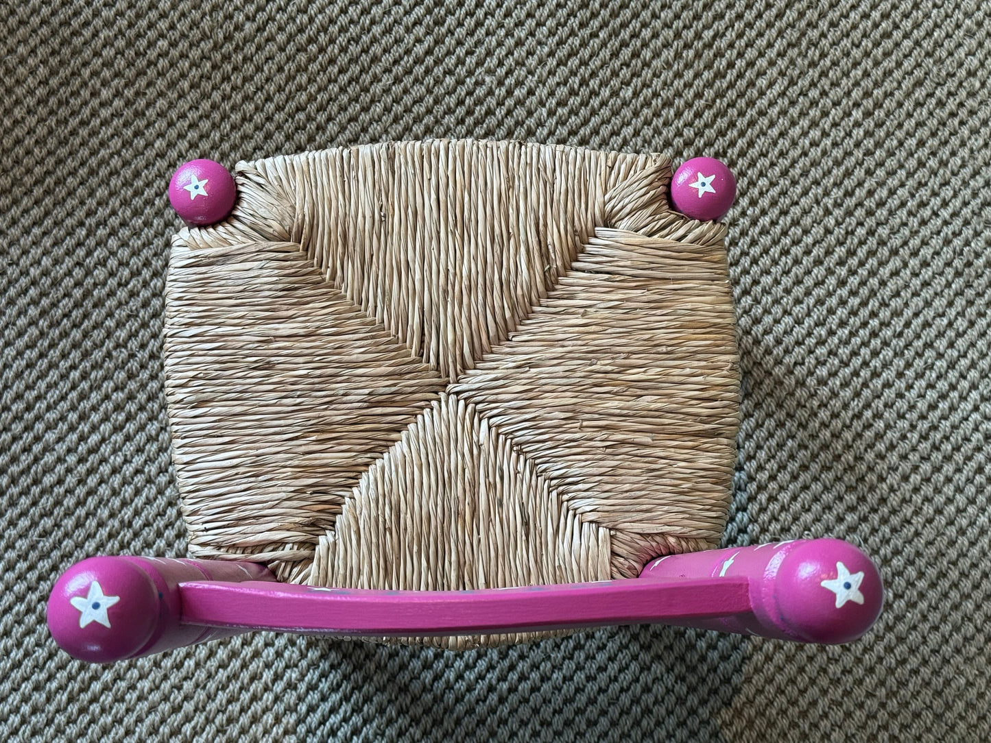 Personalised dark pink star children's chair in a nursery or bedroom — handmade gift for kids by Mimi & Mots