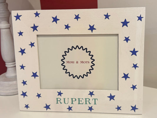 Personalised handpainted children’s photo frame with blue stars and name Rupert on white wooden frame