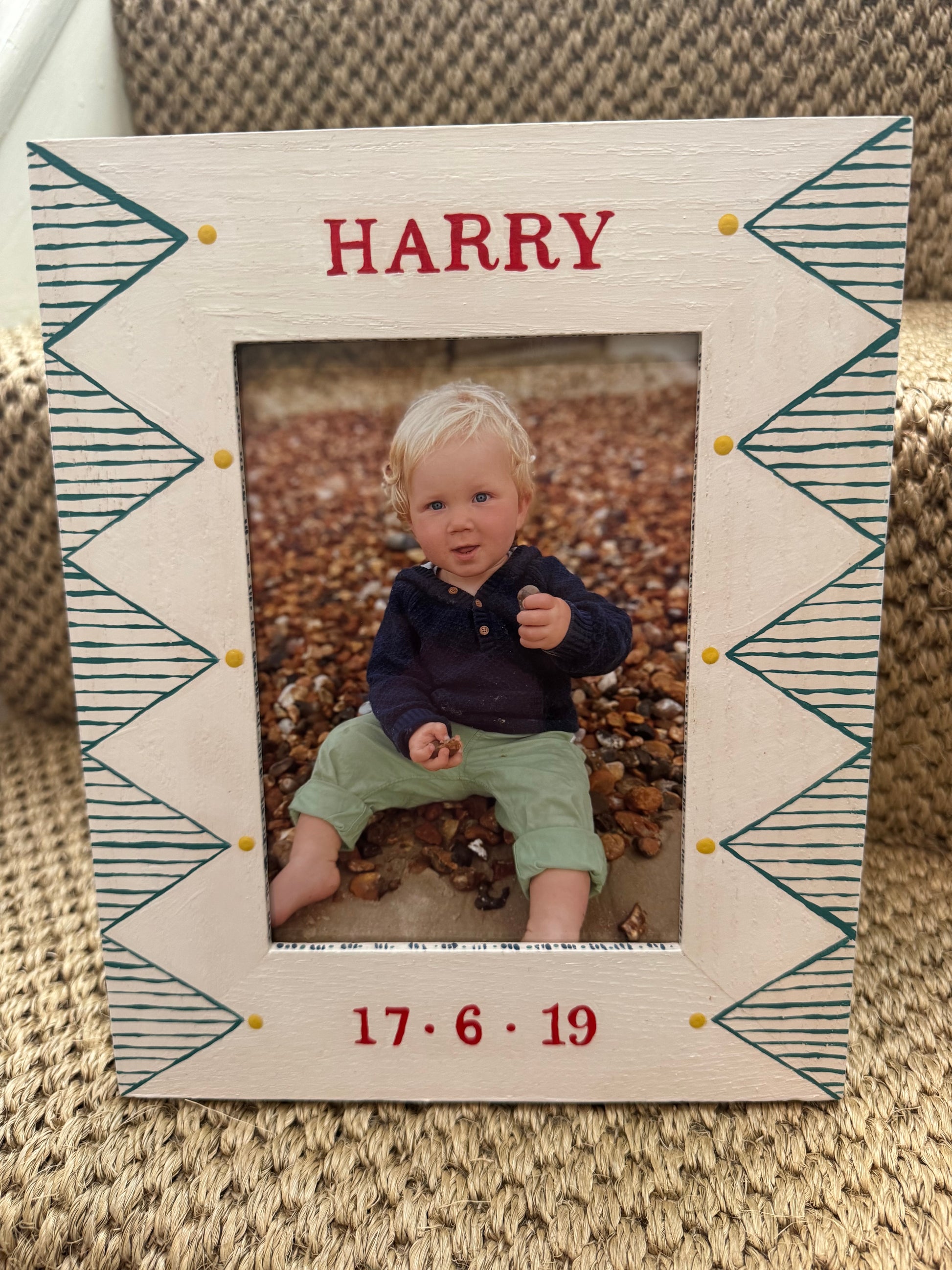 Close-up of hand-painted green geometric design on white oak children's photo frame — personalised gift by Mimi & Mots