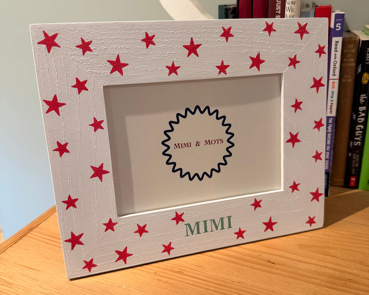 Mimi & Mots solid oak photoframe handpainted with pink stars. 